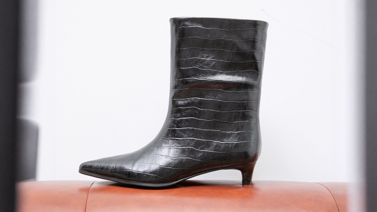 Premium Italian leather shoes in a minimalist studio setting
